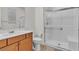 This bathroom has a glass door shower, and white cabinets at 6370 Ava Ridge Ave, Las Vegas, NV 89141