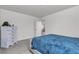 Bedroom with neutral carpet, white walls, and a white dresser with drawers at 6370 Ava Ridge Ave, Las Vegas, NV 89141