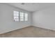 Bright bedroom with three windows showing a view of the neighborhood at 6370 Ava Ridge Ave, Las Vegas, NV 89141