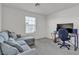 This bright bedroom has plush carpet, a sofa and a desk at 6370 Ava Ridge Ave, Las Vegas, NV 89141