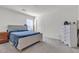 Bedroom with neutral carpet, white walls, one window, and closet with paneled doors at 6370 Ava Ridge Ave, Las Vegas, NV 89141