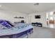 Carpeted bedroom with a desk, TV, and furniture at 6370 Ava Ridge Ave, Las Vegas, NV 89141