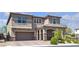 Beautiful two-story home with a two-car garage, landscaped front yard and covered porch with stone accents at 6370 Ava Ridge Ave, Las Vegas, NV 89141