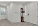 Inviting foyer with tile flooring, modern entry door, and decorative mirror, creating a stylish welcome at 6370 Ava Ridge Ave, Las Vegas, NV 89141