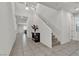 Bright foyer with tile floors, staircase, and stylish console table, creating a welcoming entrance at 6370 Ava Ridge Ave, Las Vegas, NV 89141