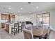 Well-lit eat-in kitchen with dining table, light wood cabinets, and tile flooring at 6370 Ava Ridge Ave, Las Vegas, NV 89141