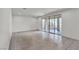 Expansive living room with tile flooring and sliding glass doors to the outside patio at 6370 Ava Ridge Ave, Las Vegas, NV 89141