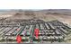 Community aerial view with street, showing house location relative to distant mountains at 6370 Ava Ridge Ave, Las Vegas, NV 89141
