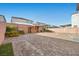 Large brick paver backyard with landscaping, exterior lighting and a pergola at 6618 Tangled Vines Ave, Las Vegas, NV 89139