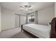 Bedroom featuring plush carpet, neutral walls, and a ceiling fan at 6618 Tangled Vines Ave, Las Vegas, NV 89139
