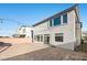 Back of the home featuring a brick-paved patio and exterior lighting at 6618 Tangled Vines Ave, Las Vegas, NV 89139