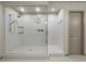 Modern shower with glass door and marble-look tile surround at 6618 Tangled Vines Ave, Las Vegas, NV 89139