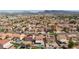 High angle shot showing a neighborhood's houses and yards, some with pools at 700 Red Bark Ln, Henderson, NV 89011