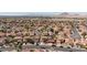 Scenic aerial view of a neighborhood with well-maintained homes, tile roofs and street parking at 700 Red Bark Ln, Henderson, NV 89011
