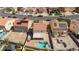 Aerial view showcases a private backyard with a pool, spa, patio and custom BBQ at 700 Red Bark Ln, Henderson, NV 89011