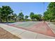 Outdoor basketball court in a well-maintained park setting with mature trees and ample space at 700 Red Bark Ln, Henderson, NV 89011