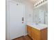 Bathroom featuring vanity sink, mirror, and tile-look flooring at 700 Red Bark Ln, Henderson, NV 89011