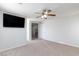 Bedroom featuring ceiling fan, TV and access to additional rooms at 700 Red Bark Ln, Henderson, NV 89011
