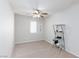 Bedroom featuring a ceiling fan, shelving unit and natural light at 700 Red Bark Ln, Henderson, NV 89011
