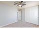 Bedroom featuring ceiling fan, closet and neutral carpet at 700 Red Bark Ln, Henderson, NV 89011