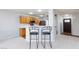 Kitchen featuring a breakfast bar with chairs, offering a casual dining space at 700 Red Bark Ln, Henderson, NV 89011