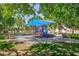 Community playground under shade canopy in well maintained park at 700 Red Bark Ln, Henderson, NV 89011