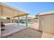 Backyard patio featuring a refreshing pool with hot tub and shed, great for outdoor storage at 700 Red Bark Ln, Henderson, NV 89011