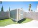 Backyard features a storage shed, artificial turf, and a block wall for privacy at 7231 Sequoia Springs Dr, Las Vegas, NV 89147
