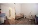 Cozy bedroom with wood flooring, comfortable bed, and ample closet space at 7231 Sequoia Springs Dr, Las Vegas, NV 89147