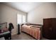 Cozy bedroom with hardwood floors, a workspace, natural light, and closet storage at 7231 Sequoia Springs Dr, Las Vegas, NV 89147