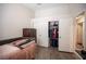 Bedroom features hardwood floors, open closet space and access to another room at 7231 Sequoia Springs Dr, Las Vegas, NV 89147