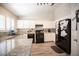 Spacious kitchen featuring modern appliances, granite counters, and plenty of cabinet storage at 7231 Sequoia Springs Dr, Las Vegas, NV 89147