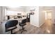Well-lit eat-in kitchen with stainless steel appliances, modern countertops and bar stool seating at 7231 Sequoia Springs Dr, Las Vegas, NV 89147