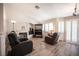 Bright living room with wood flooring, vaulted ceilings, fireplace, and plenty of natural light at 7231 Sequoia Springs Dr, Las Vegas, NV 89147