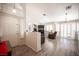 Open living space features vaulted ceilings, wood floors, fireplace and shuttered windows at 7231 Sequoia Springs Dr, Las Vegas, NV 89147