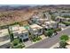 Aerial view of a neighborhood featuring modern homes, mountain views, and desert landscapes at 734 Glowing Horizon St, Henderson, NV 89052