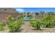 Backyard oasis featuring a sparkling pool and lush landscaping, perfect for outdoor living at 734 Glowing Horizon St, Henderson, NV 89052