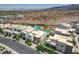 Aerial neighborhood view of modern desert homes with landscaping and community pools at 734 Glowing Horizon St, Henderson, NV 89052