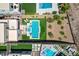 Stunning aerial view of backyard oasis with pool, spa, and modern outdoor furniture at 734 Glowing Horizon St, Henderson, NV 89052