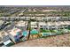 Aerial view showcases modern homes with desert landscaping, with some homes featuring private pools at 734 Glowing Horizon St, Henderson, NV 89052