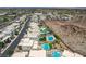 An aerial view shows luxurious homes with private pools in a desert-landscaped community at 734 Glowing Horizon St, Henderson, NV 89052