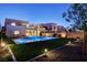 Backyard featuring a modern pool, fire pit and view of the home at 734 Glowing Horizon St, Henderson, NV 89052
