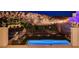 Scenic backyard with pool and landscaping offers a private retreat with mountain views at 734 Glowing Horizon St, Henderson, NV 89052