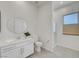 Well-lit bathroom with vanity, mirror, toilet, and walk-in shower with glass door at 734 Glowing Horizon St, Henderson, NV 89052