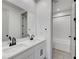 Modern bathroom featuring double sinks with white cabinets and matte black hardware at 734 Glowing Horizon St, Henderson, NV 89052