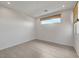 This bright bedroom features tile floors, natural light, and neutral walls at 734 Glowing Horizon St, Henderson, NV 89052