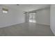 Serene bedroom with neutral palette, tile flooring, balcony access and sliding glass door, creating a peaceful retreat at 734 Glowing Horizon St, Henderson, NV 89052