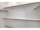 Walk-in closet features built-in shelving and rods for organization at 734 Glowing Horizon St, Henderson, NV 89052