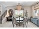 Stylish dining room with decorative light fixture and large window for natural light at 734 Glowing Horizon St, Henderson, NV 89052