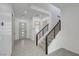 Bright entryway featuring tiled floors, stairs, and a view into the next room at 734 Glowing Horizon St, Henderson, NV 89052